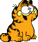 Garfield sitting, looking up excited.