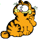 Garfield sitting, looking over shoulder excited, paw to mouth.