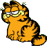 Garfield sitting smiling at viewer.