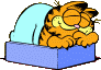 Garfield sleeping in bed, content, 1980.