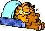 Garfield sleeping in bed, holding Pookie.