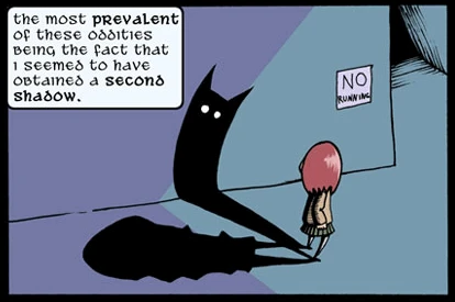 Comic panel showing Annie, a redhead girl in a hallway with her own shadow and another coming from her, with white eyes. She narrates, saying 'The most prevalent of these oddities being the fact that I seemed to have obtained a second shadow'.