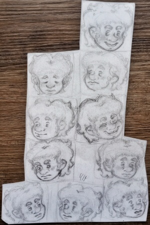 A bunch of Mark heads sketched in pencil, showing him with various expressions. His hair is fluffy and his nose is very upturned.