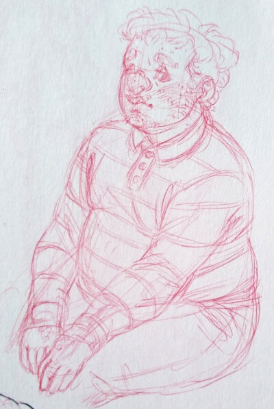 Teenage Mark sitting with his hands on his knees. He's wearing jeans and a long sleave shirt with stipes.
