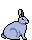 a pastel grey blue bunny sitting attentively.