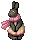 dark grey bunny sitting up, wearing a pale yellow dress and a pink scarf.