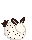 A white sea bunny with black ears, tails, and speckles. Its sitting loaf style.