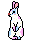 White clown bunny with a round red nose and pastel spots on its fur.